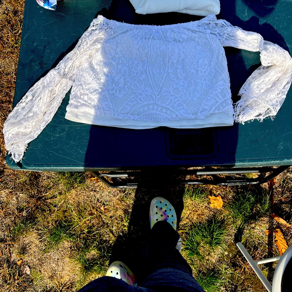 Cat and jack is selling a white long sleeve top with lacey sleeves size six kid